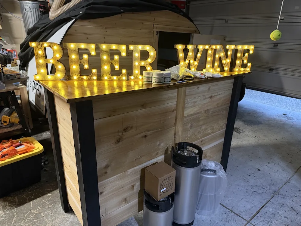 Keg and bar next to tap trailer